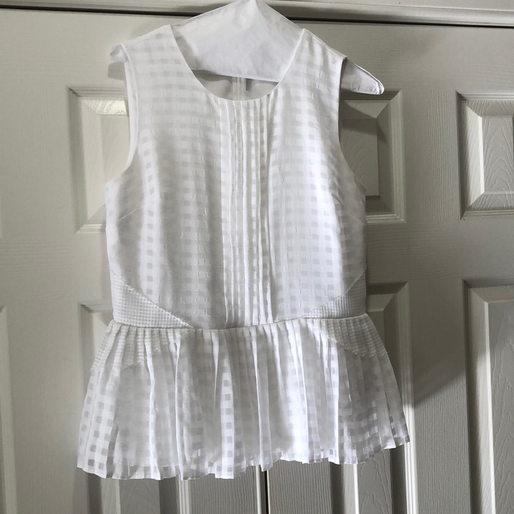 Sleeveless peplum top